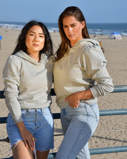 Heather grey cotton fleece long sleeve sweatshirt on 2 models at the beach