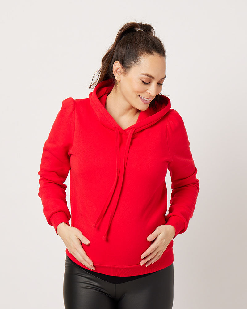 Varsity Red cotton fleece long sleeve sweatshirt on pregnant model looking down