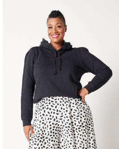 Black cotton fleece long sleeve sweatshirt on smiling model