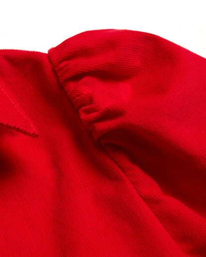 Shoulder detail of red Japanese corduroy puff sleeve button down