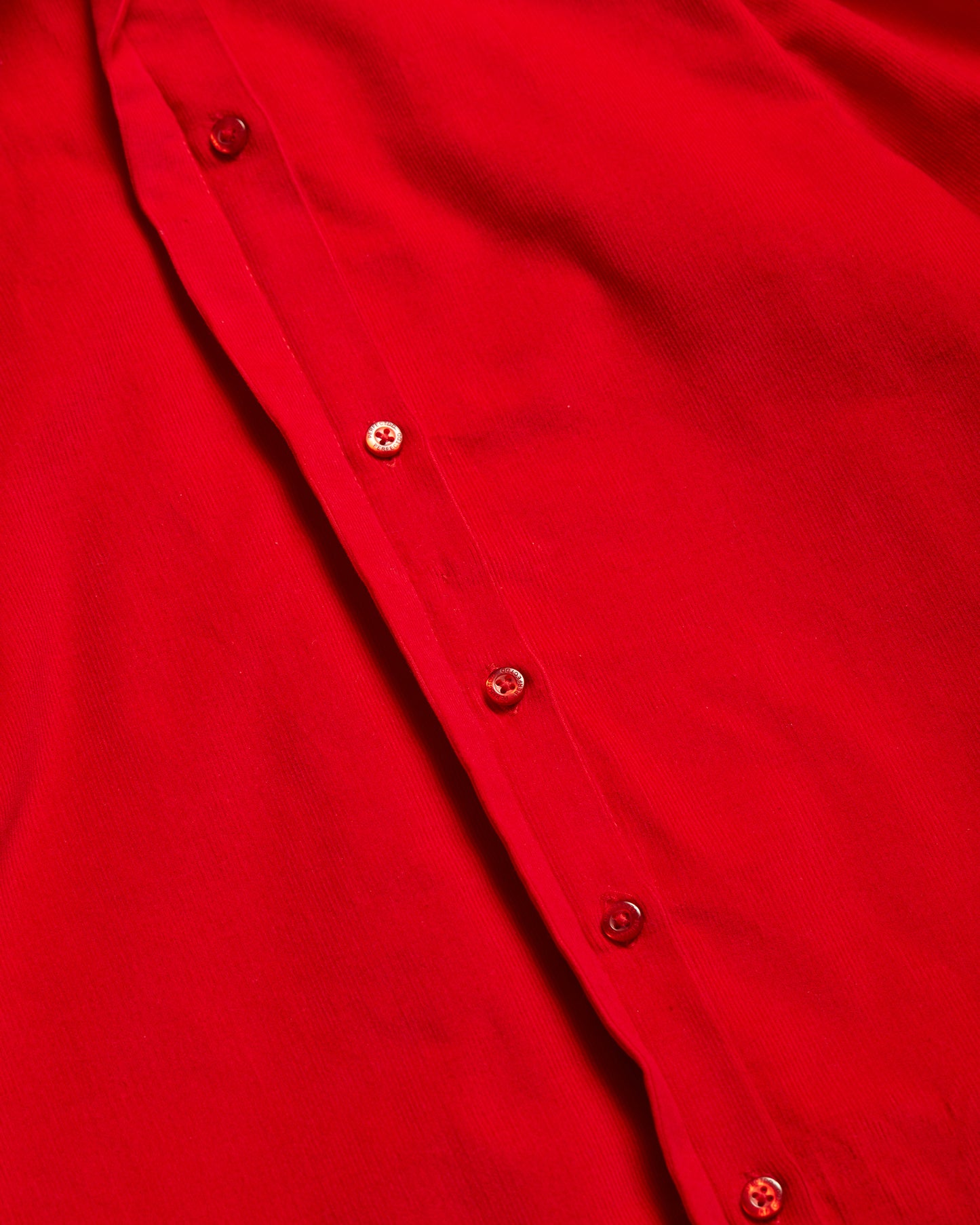 Button details of red Japanese corduroy puff sleeve button down