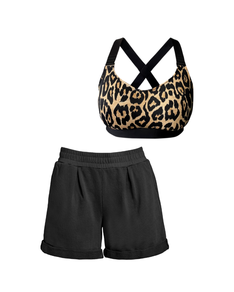 Front flat lay of leopard recycled polyester sports bra and black cotton pleated sweat shorts