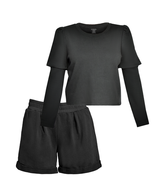 Flat lay of black organic cotton crewneck double sleeve sweatshirt and black cotton pleated shorts