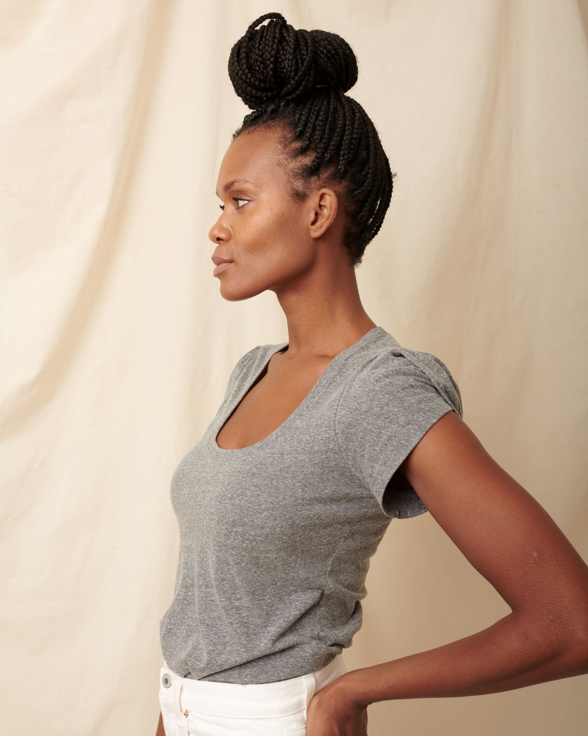 Side profile of heather grey supima cotton scoopneck tulip sleeve tee