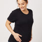 Black cotton rolled sleeve tshirt on smiling pregnant model holding belly and looking down