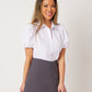 White cotton short sleeve button down on smiling asian model wearing grey skort