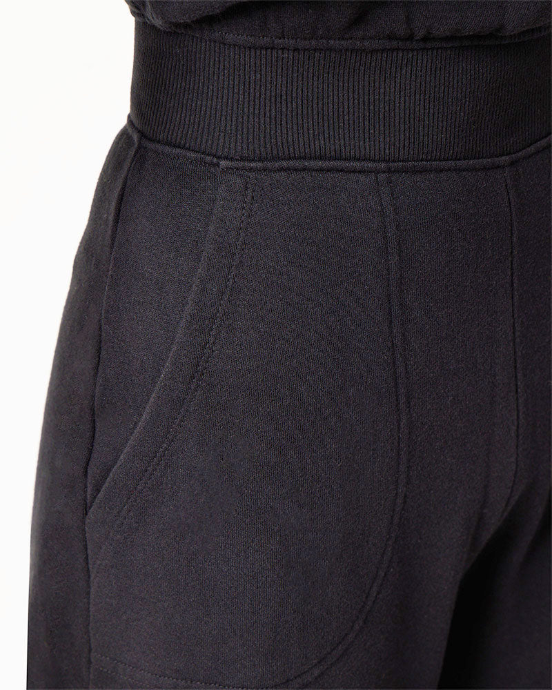 Pocket detail of black cotton fleece jumpsuit