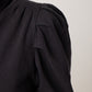 Shoulder detail of black organic cotton turtleneck
