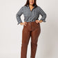 Plaid cotton long sleeve classic button down tucked into brown leather pants on smiling white model