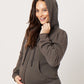 Grey cotton fleece puff sleeve zip up sweatshirt zipped on smiling pregnant model while holding hood and belly