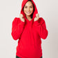 Varsity Red cotton fleece long sleeve sweatshirt on pregnant model holding hood
