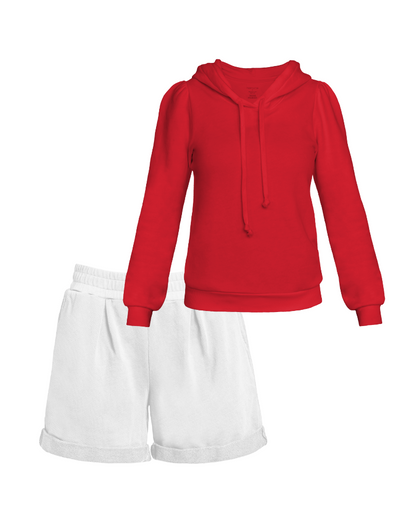 Flat lay of red puff sleeve sweatshirt and white pleated shorts
