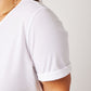 Side profile of shoulder detail on white cotton rolled sleeve tshirt