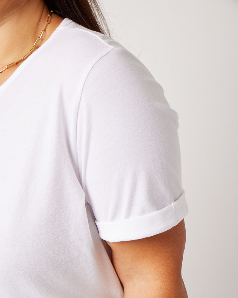 Side profile of shoulder detail on white cotton rolled sleeve tshirt